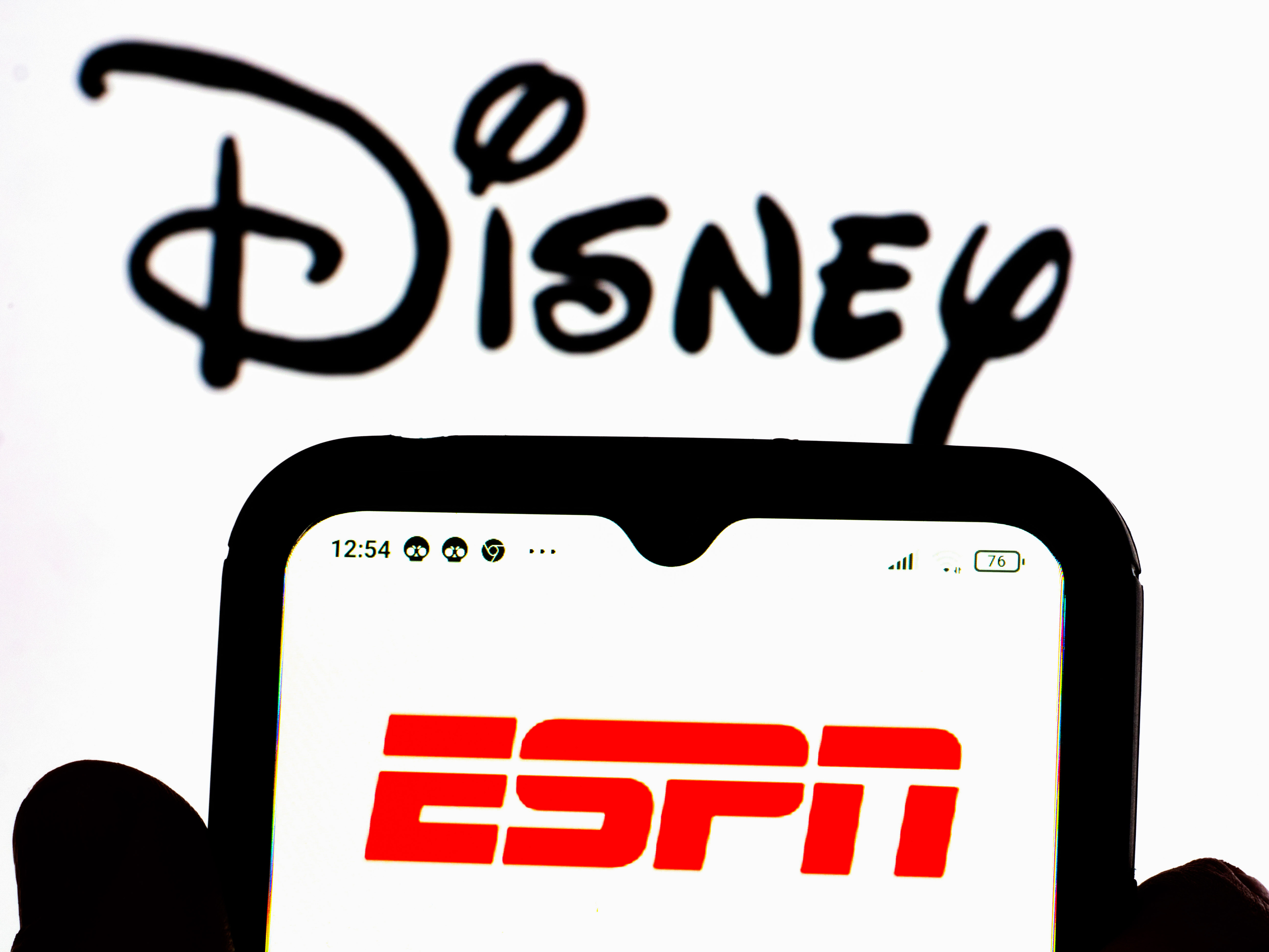 In this photo illustration, the ESPN logo is displayed on a...